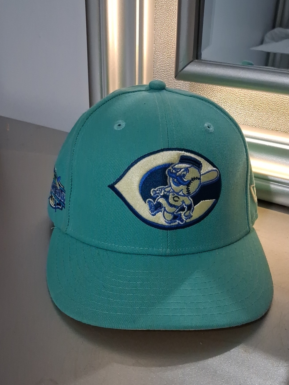 New Era Teal Baseball Cap with Embroidered Mascot Patch